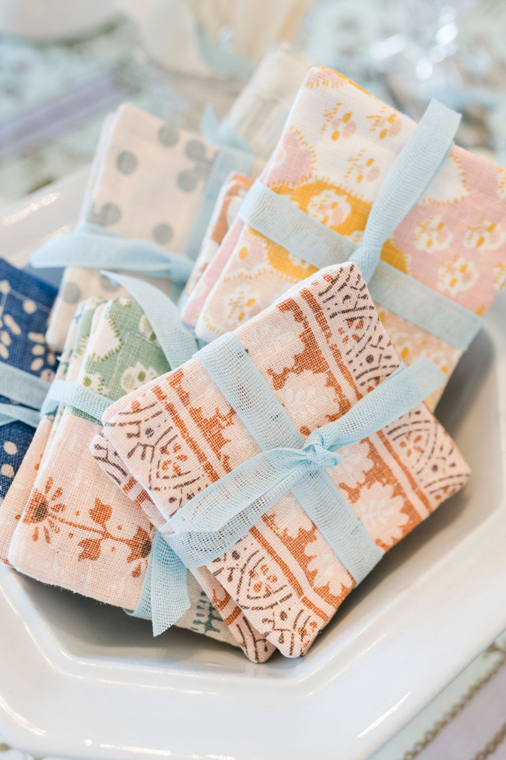Packaged products with decorative ribbons on a white surface